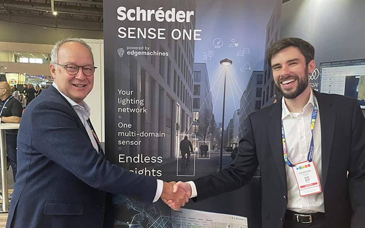 Philippe Felten, CEO of Schréder (left), and Alex McCarthy, co-founder of EdgeMachines (right), celebrate the acquisition.