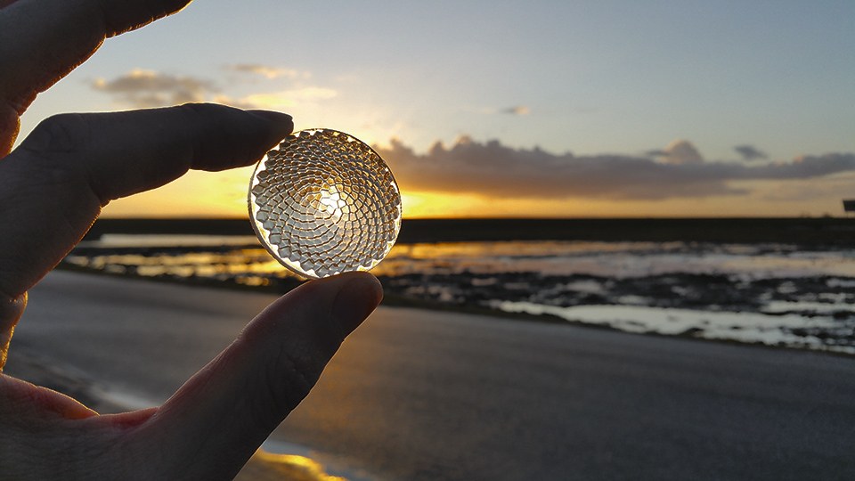 Figure 11: With additive optics design and fabrication, complexity is “free”: designing and printing a complicated lens is no more difficult than a basic one - “Sunflower Fresnel”, a multi-facet lens precisely directing light to the illumination target