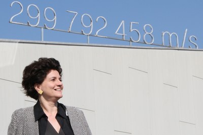 Martina Paul at the Festpielhaus in Bregenz. The date of Day of Photonics on October 21st was chosen to commemorate when the General Conference of Weights and Measures adopted the value of 299,792.458 km/s for the speed of light on 21 October 1983.