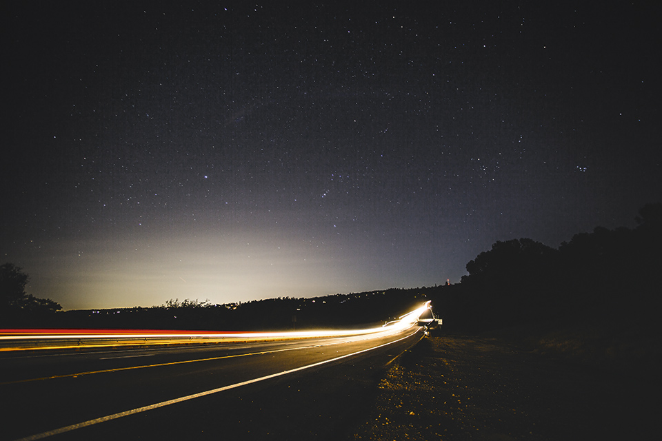 Figure 3: Illuminated road and visible skyglow in a suburban area in the US (Photo Credits: Mark Tuzman/Unsplash)