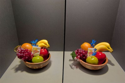 In the test setup, similar bowls of fruit were placed in a lightbox with a divider in the middle. In this photo, the bowl on one side was illuminated by a diode laser light and the other was lit by a standard incandescent bulb. The aesthetic quality of diode laser lighting (left bowl) compares favorably with standard incandescent lighting (right). (Photo by Randy Montoya)